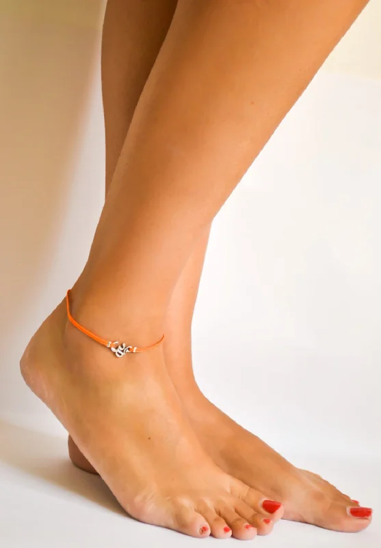 anklets for summer for women-Orange cord anklet with silver Om charm, yoga jewelry